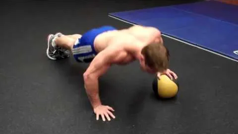 One-arm push-up on medicine ball